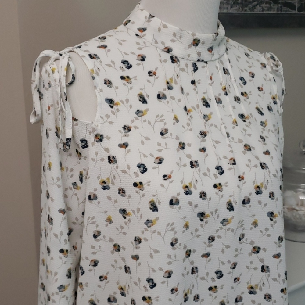 Cold shoulder high neck floral blouse